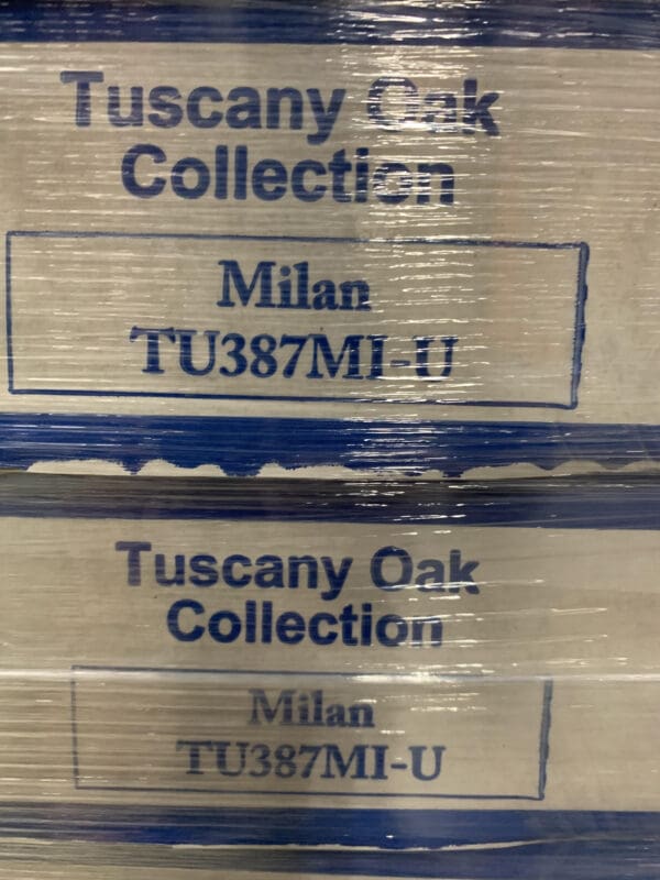 A stack of boxes with the words tuscany oak collection on them.